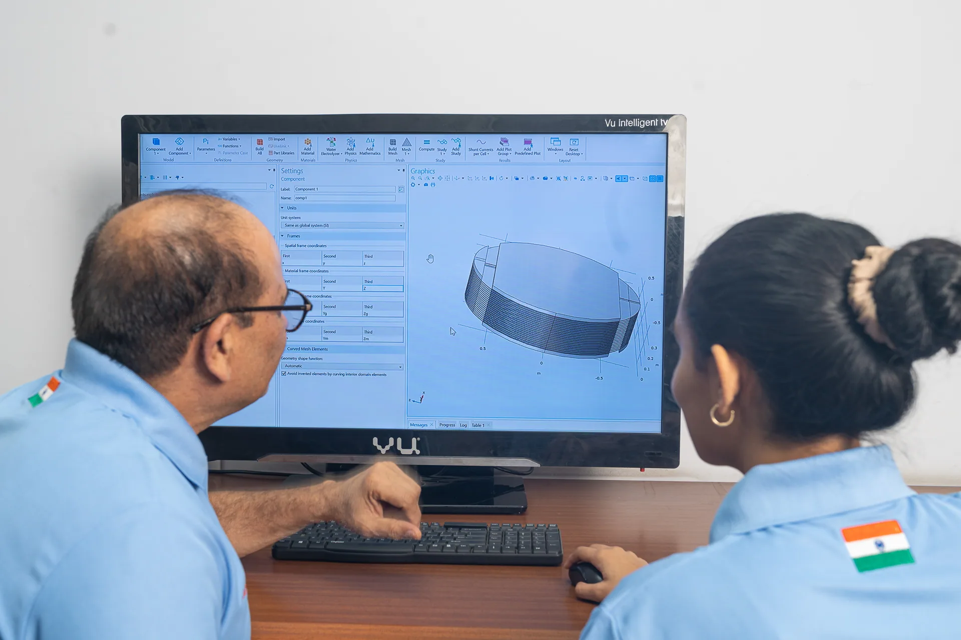 Engineers reviewing a flow simulation of a mesh component at BVK